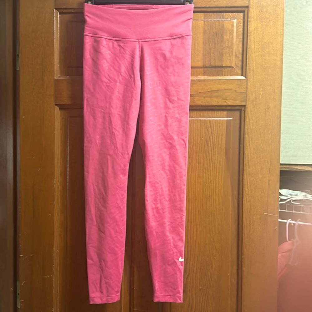 Nike Dri-fit women’s leggings with swoosh pattern salmon color